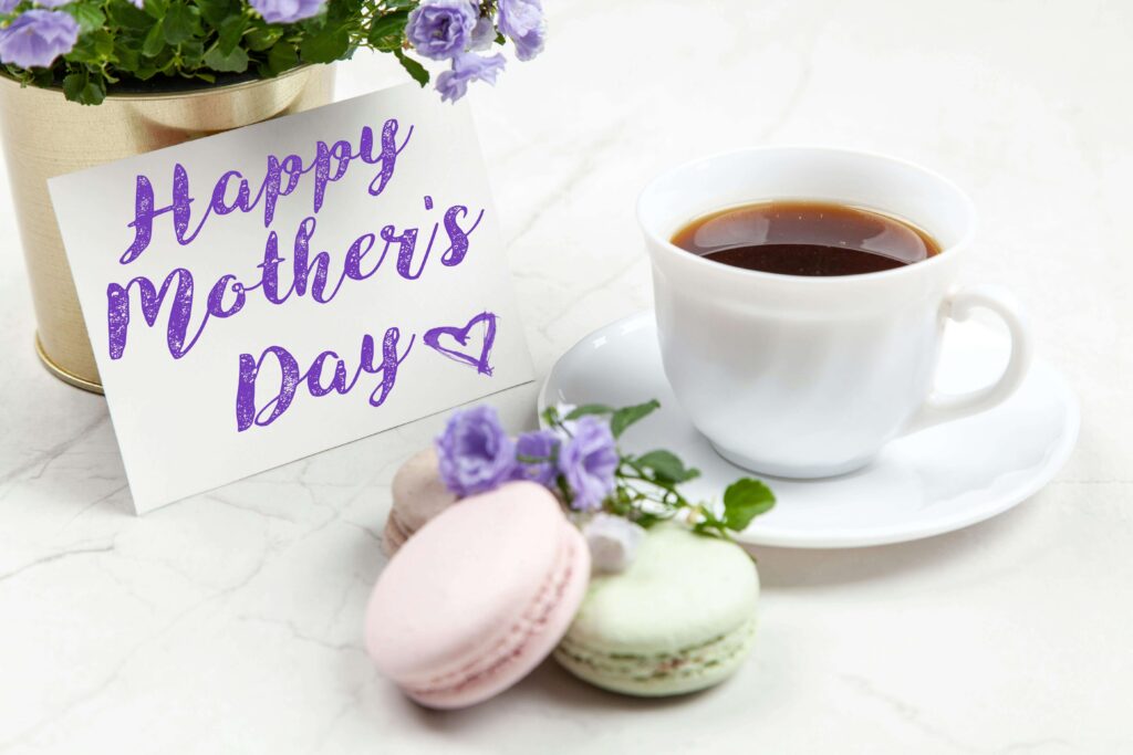 Mothers day brunch ideas hosted outdoors with throws on chairs and potted plants on the table