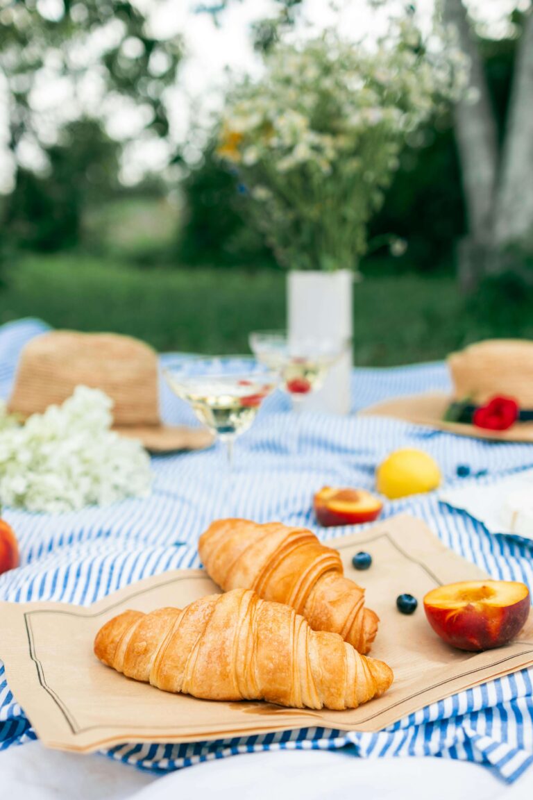 Mother’s Day brunch table with vintage dishes, fresh flowers, and herbal lemonade on a spring morning porch