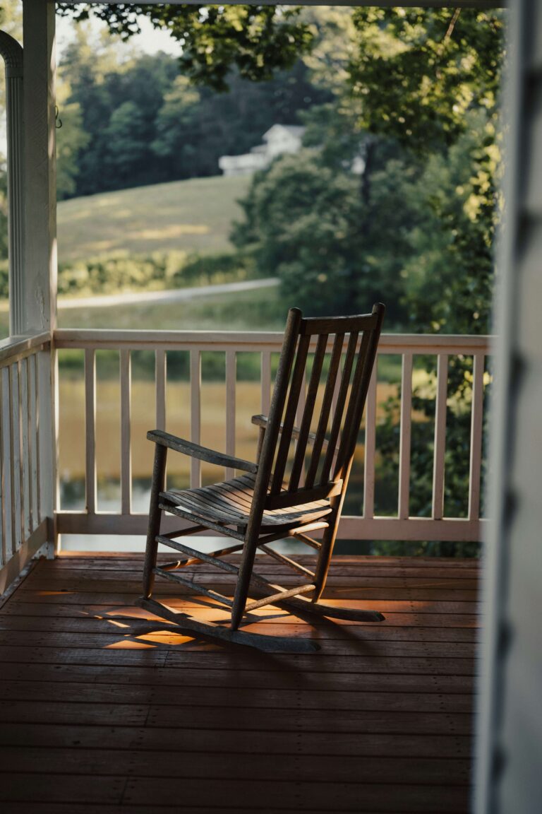outdoor rocking chair on porch in new england